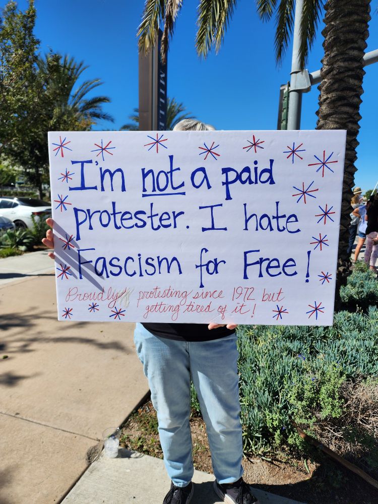 Protest sigh: I'm not a paid protester. I hate fascim for free.