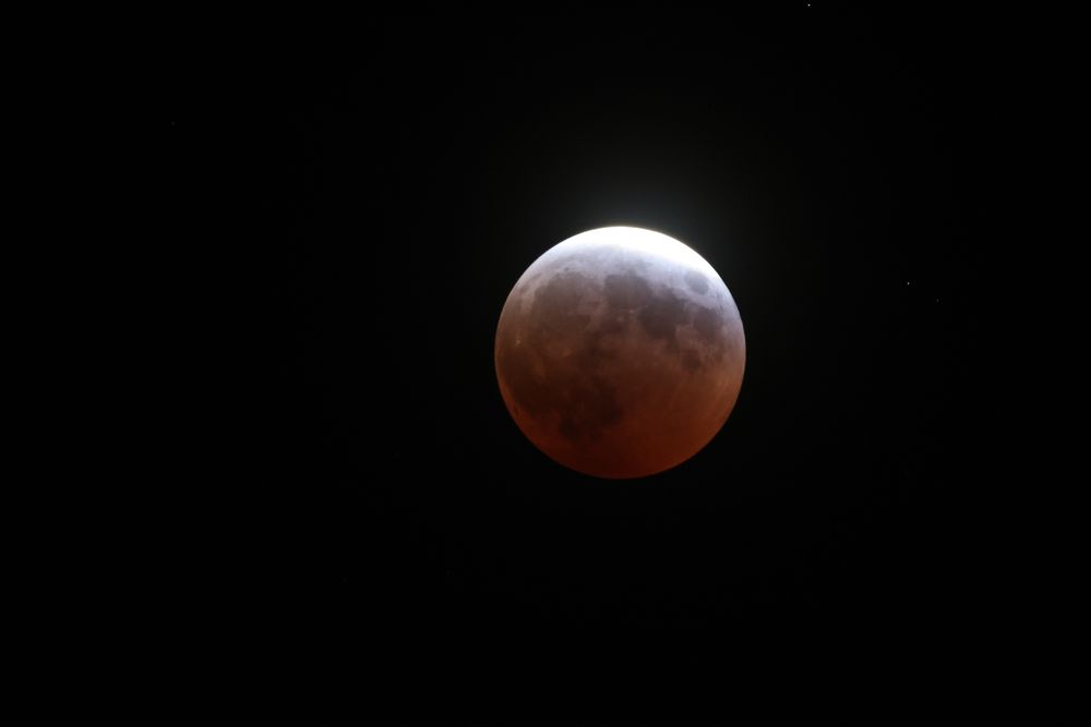 Lunar eclipse about half an hour before maximum darkness.