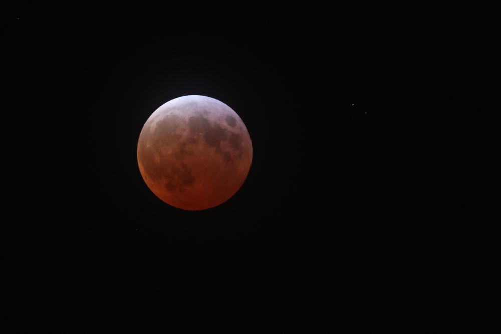 Lunar eclipse about 15 minutes before maximum darkness.