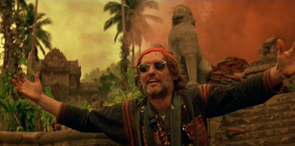 Dennis Hopper as an insane photojournalist in "Apocalypse Now" (1979). "I'm an American! Zap 'em with your siren, man!"
