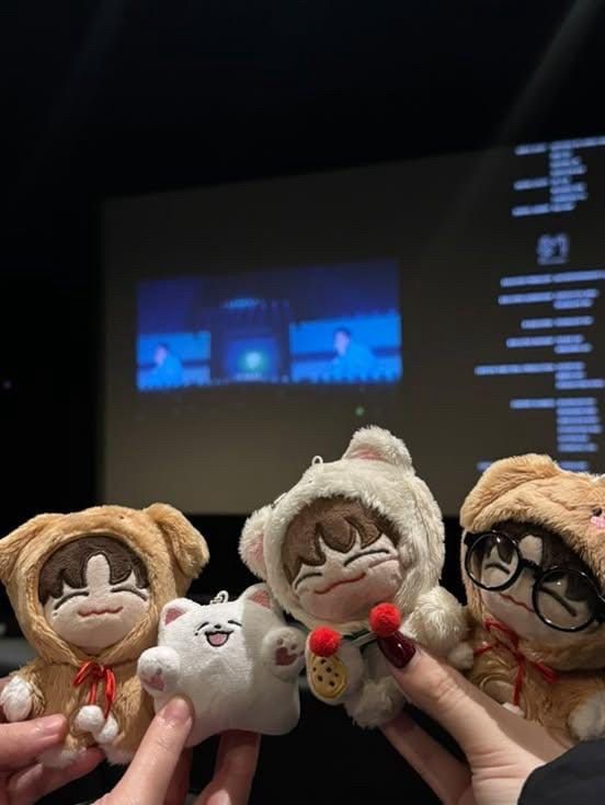 NCT Dream mascots in a line: Jeno, Samoyed, Chenle and Jisung. They’re at the cinema for a viewing of NCT Dream’s concert film 
