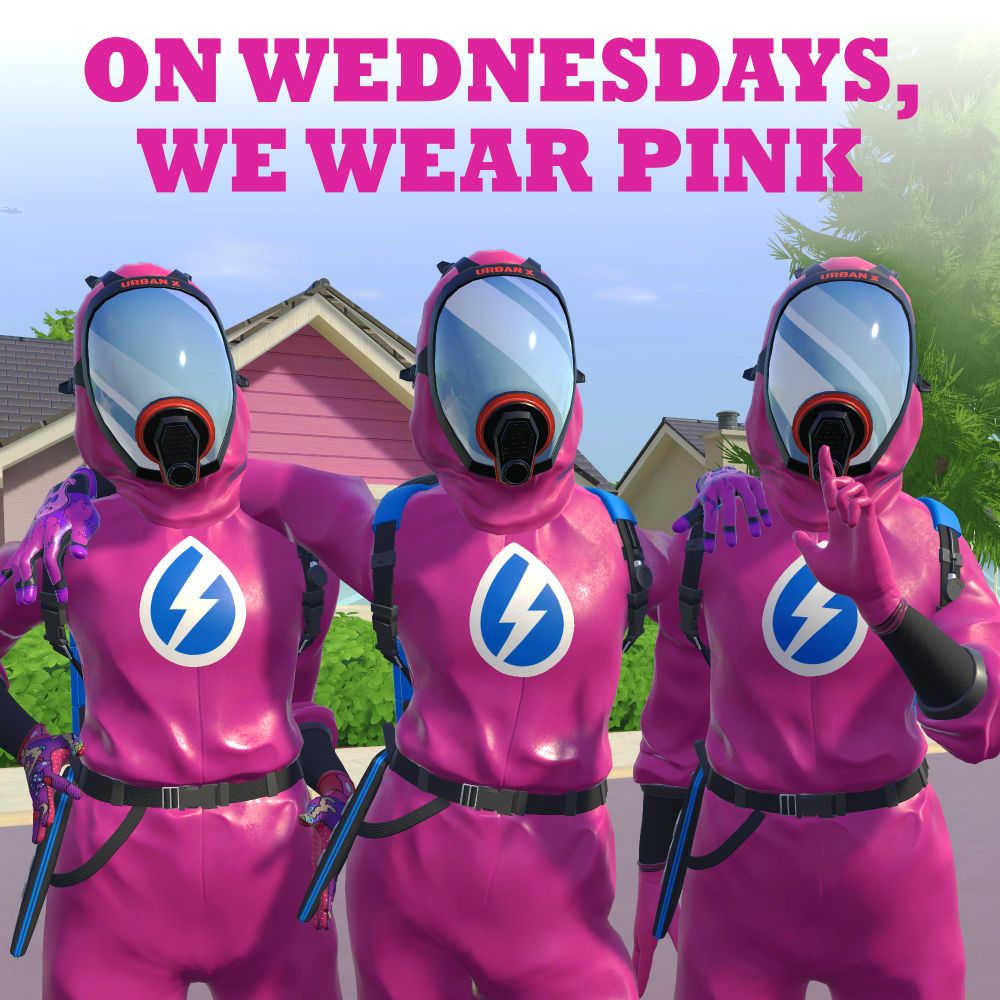 Three washers posing together, all dressed in pink with the words "on Wednesday, we wear pink" at the top of the image