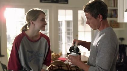 still from the folgers commercial featuring a brother and sister that are definitely into each other 