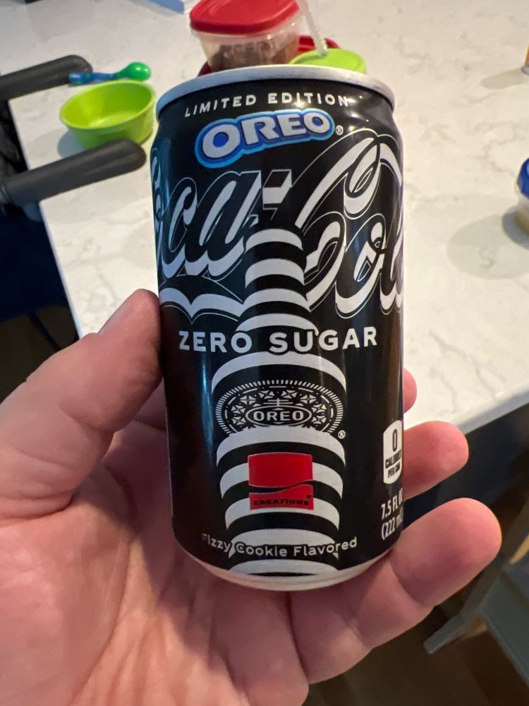 picture of me holding a can of coke zero that purports to be oreo flavored. it is unopen.