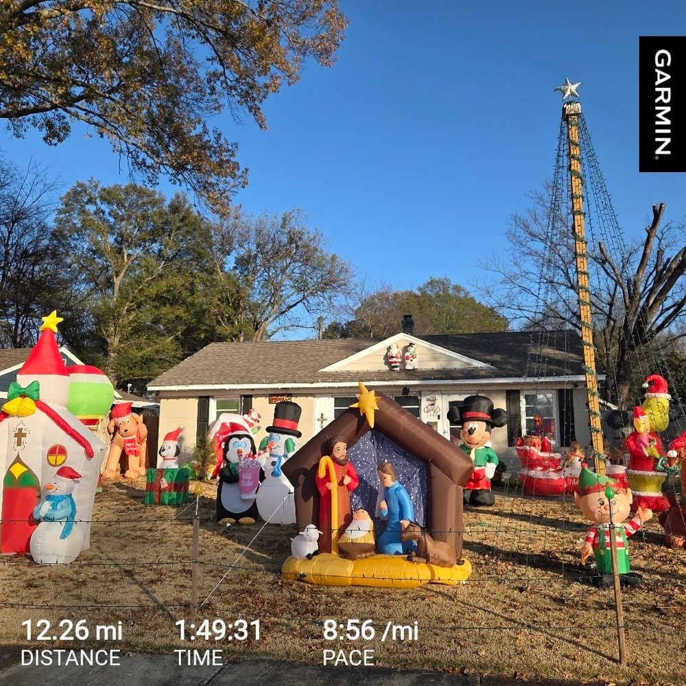 An absolute clusterfuck of inflatable Christmas decorations in someone's yard