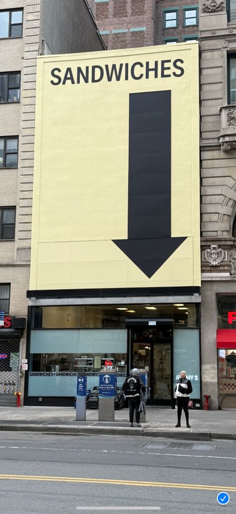 Giant arrow to store that says “Sandwiches”