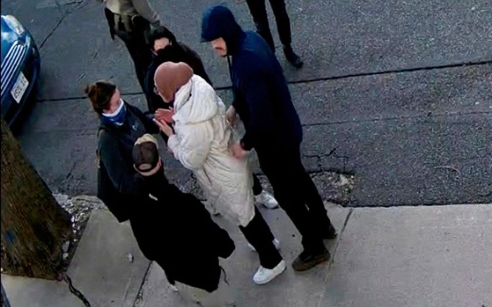  Rumeysa Ozturk getting kidnapped on the street by several people in plain clothes -- hoodies, jackets, and masks. 