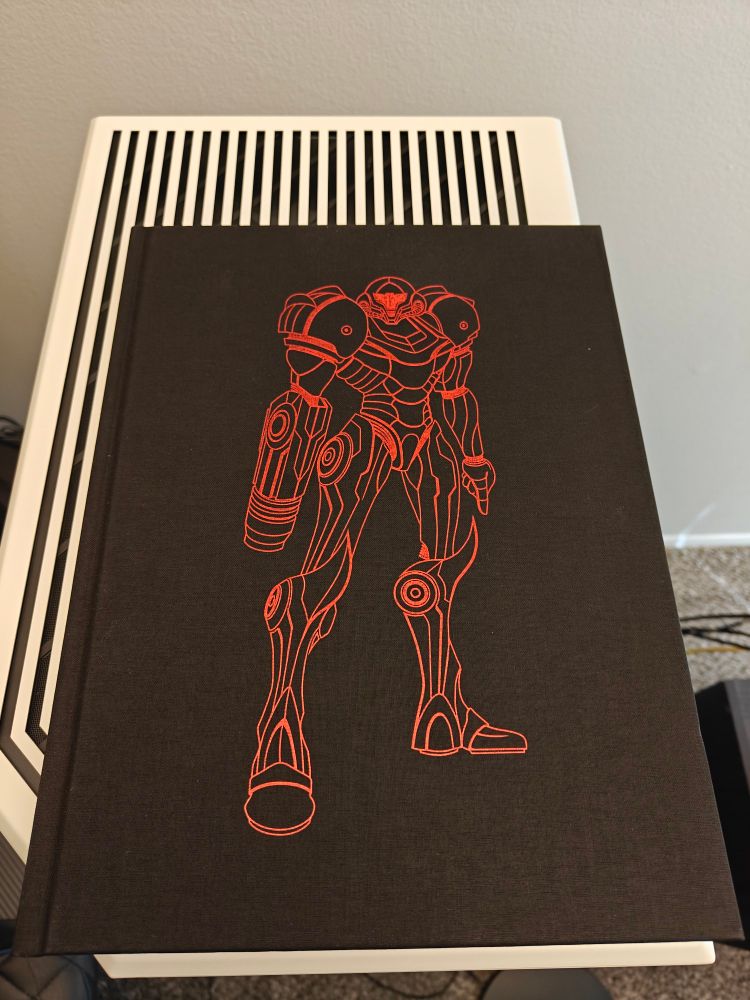 Picture of the Metroid Prime 1-3: A Visual Retrospective book taken from the top