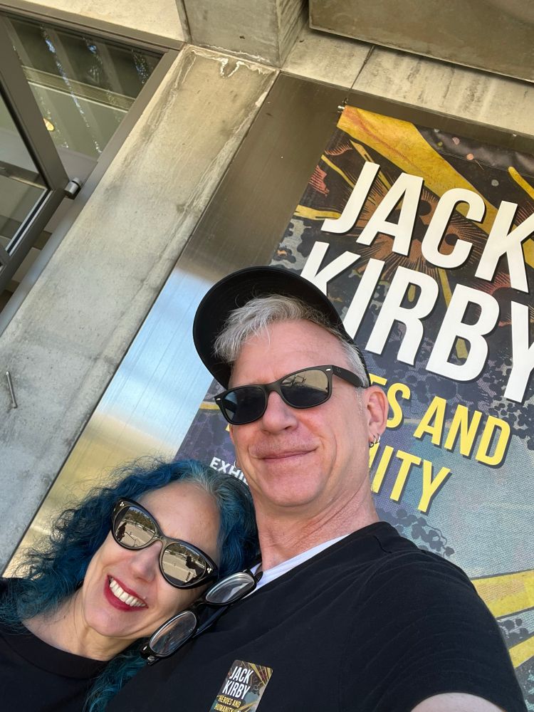 Nathaniel and me in front of the poster for the Jack Kirby exhibition 