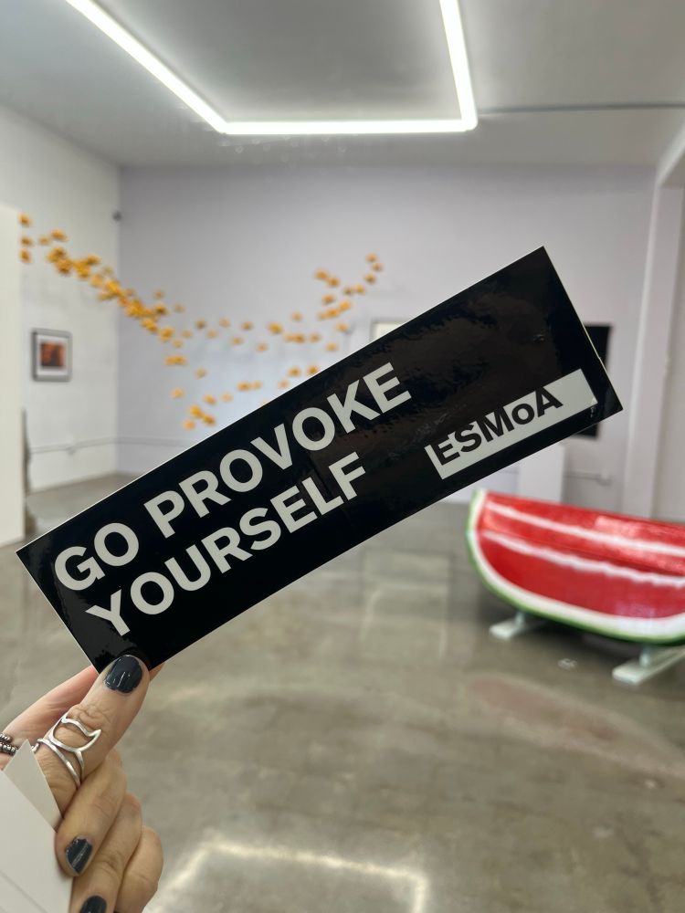 A sticker that says Go Provoke Yourself 