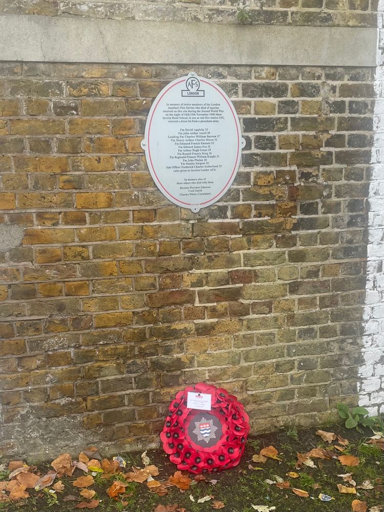 Memorial Plaque at Invicta Road School complete with poppy wreath placed by the modern day firefighters at East Greenwich Fire Station 