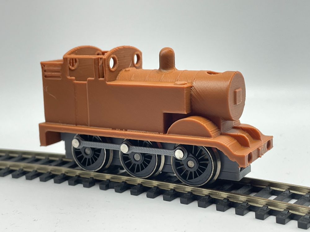 This is a side shot of the Thomas locomotive on its own. A lack of buffers or a smokebox door are prominent from this angle.