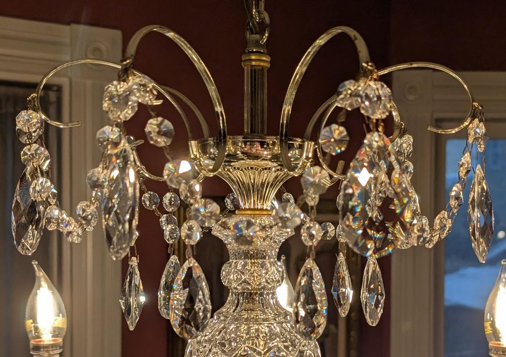 Another close-up of the upper level of crystals in the chandelier, where the gap visible in the previous photo is now filled by a brand new, sparkly crystal.