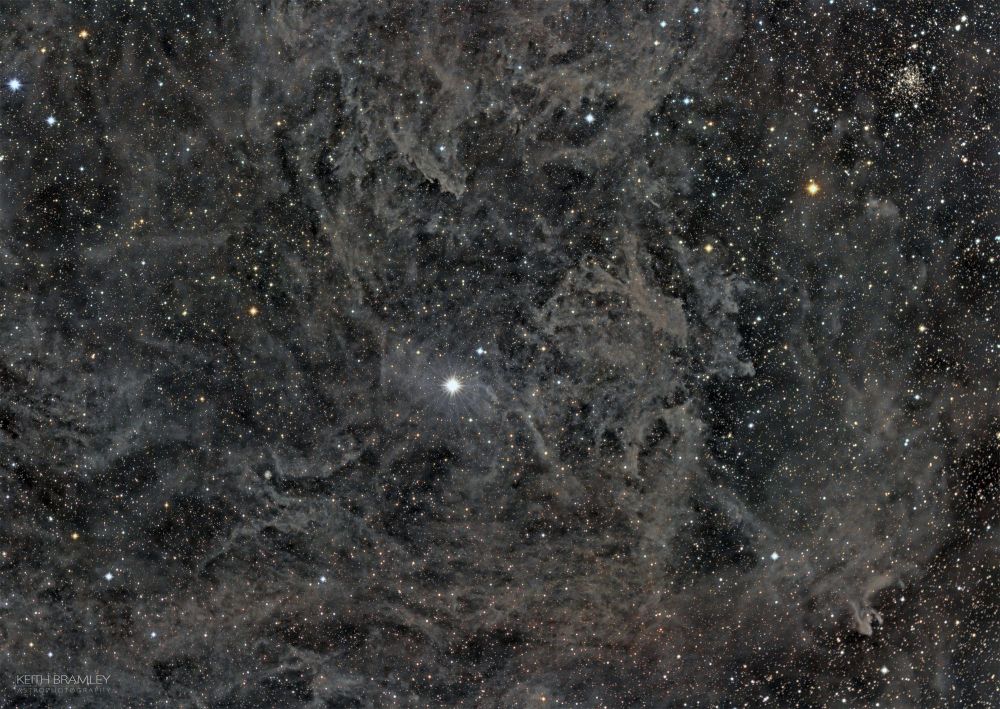 The bright star in the middle is Polaris (The Pole Star), this is surrounded by faint dust, this dust is called the Integrated Flux Nebula and is dust and gas outside the plane of our galaxy which is illuminated not by one star but  the total flux of all the stars in the Milkyway