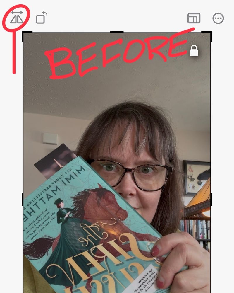 Screenshot of a video with a person holding a book where the text presents as a mirror image. The video editing icon to reverse image is circled in red and labeled “before”