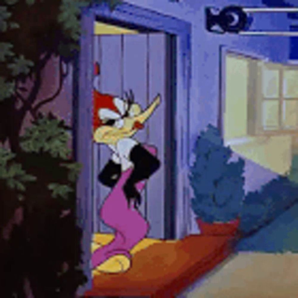 woody woodpecker is standing in the doorway of a house .