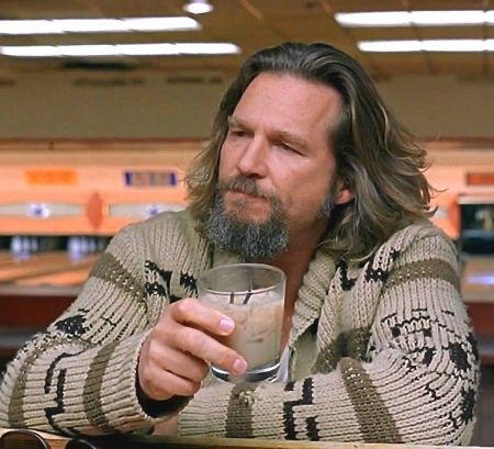 The dude from The Big Lebowski enjoying a White Russian in the bowling alley