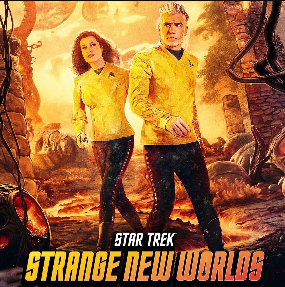 Promotional picture of Strange New Worlds with Captain Pike and Una walking on a strange planet with ruins all around them. Everything is in yellow, orange and black colours.