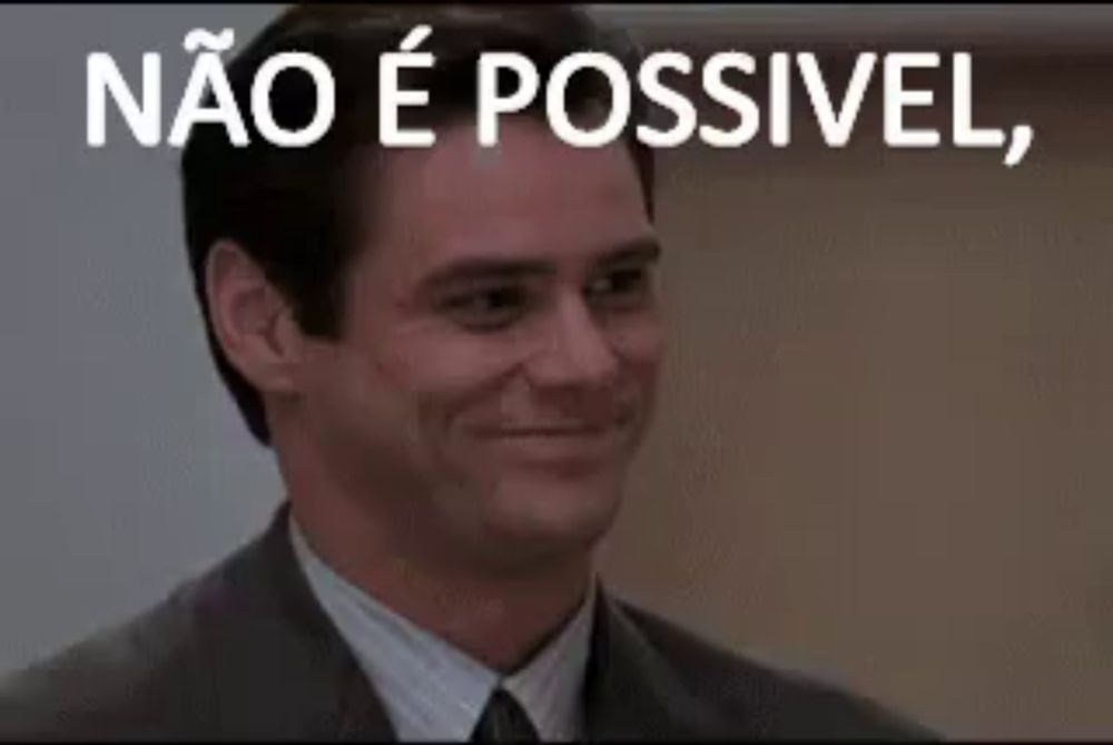 a man in a suit and tie is smiling with the words `` não é possivel '' written above him .