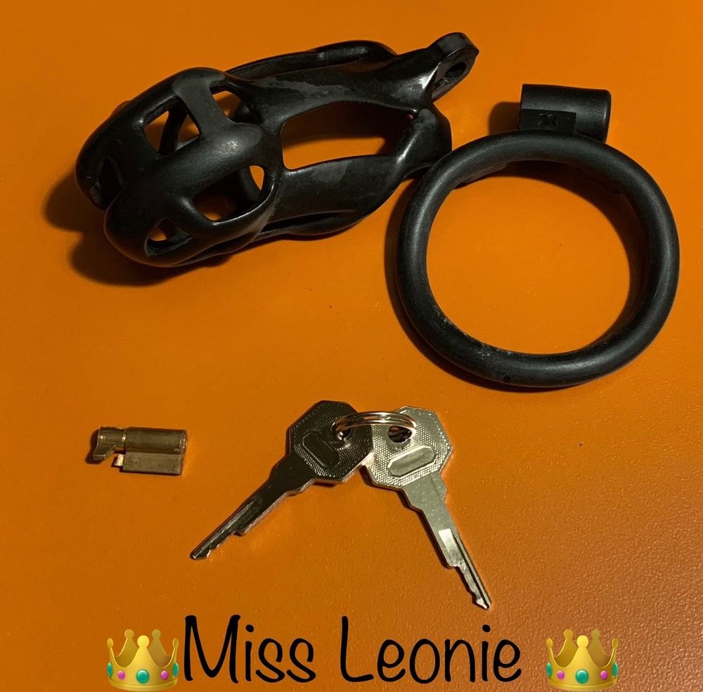 Chastity, cage, and accompanying keys, waiting to be worn