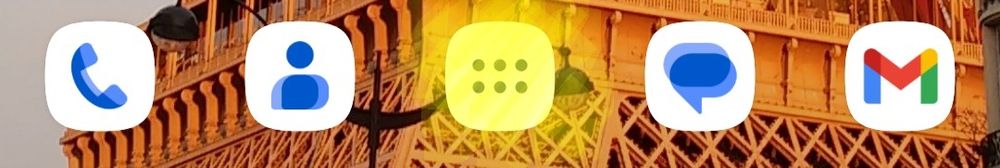 Capture d'écran d'une ligne d'icônes, avec au milieu le bouton d'ouverture du tiroir d'applications surligné