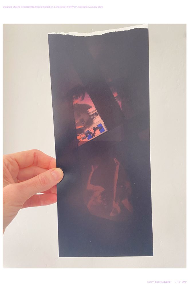 Hand holding test strip from the analogue darkroom. Showing edge of a zoom call in off-colours and a performance still from #Sergina's very first live performance ever, that took place in May 2014 at The Banff Centre. 