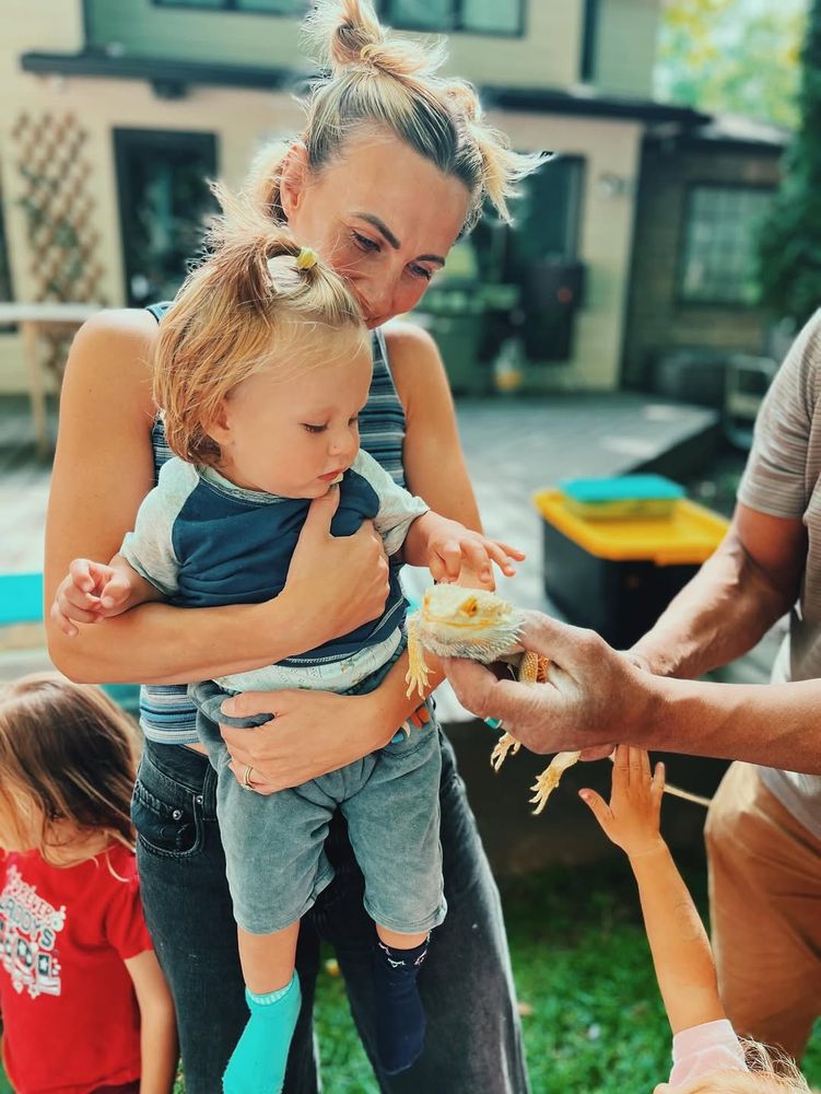 jenna holding tommy, him eating a cupcake