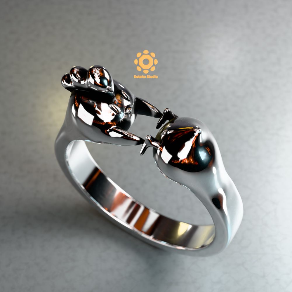 3D render of a sterling silver ring resting on it's shank on a surface. The ring looks like a stylized chicken stretched into the shape of a ring with the head and legs meeting in the top of the ring. The chicken is touching it's own legs. The view is a closeup from above of the ring.