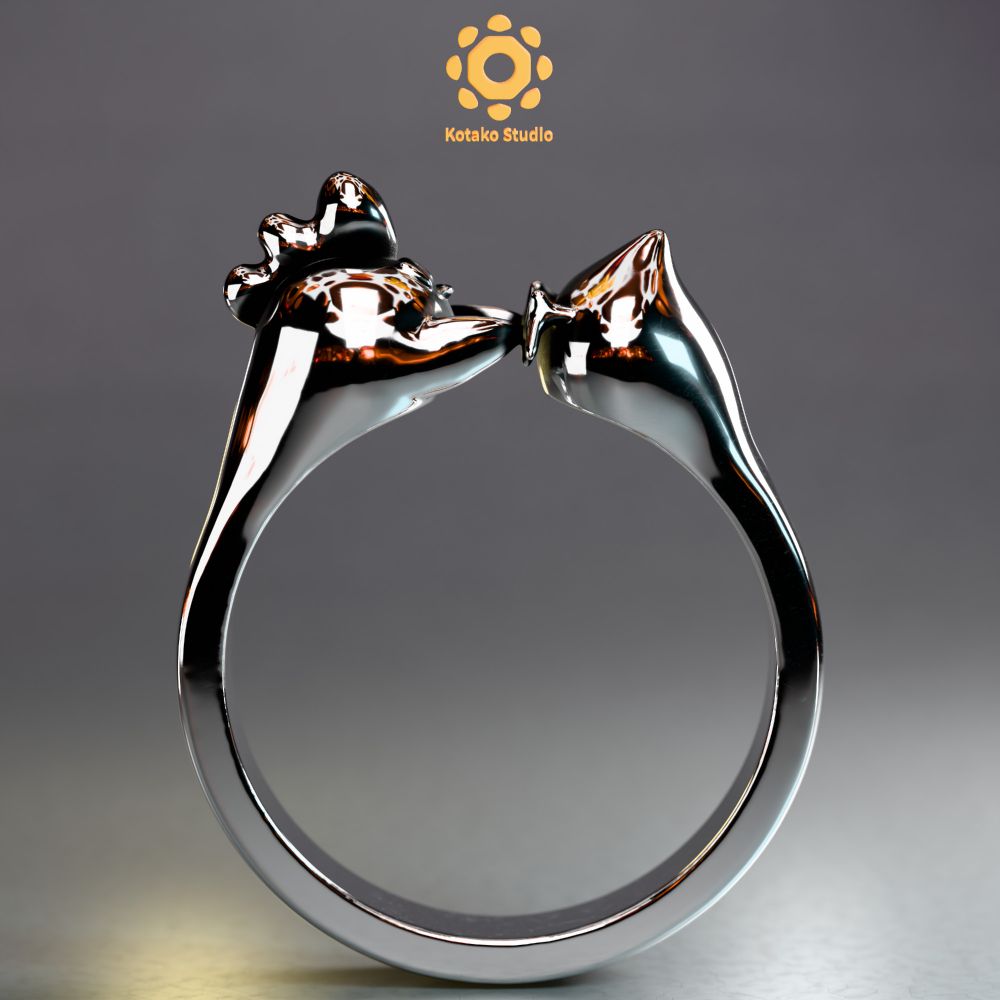 3D render of a sterling silver ring resting on it's shank on a surface. The ring looks like a stylized chicken stretched into the shape of a ring with the head and legs meeting in the top of the ring. The chicken is touching it's own legs. The view is from the side of the ring.