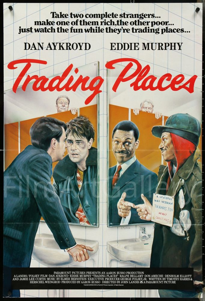 British poster for the American comedy movie "Trading Places" (1983).
taking the middle and the bottom of the poster, the acrylic print illustration by Adrian Purkis shows main characters "Louis Winthorpe III" (played by actor Dan Aykroyd) and "Billy Ray Valentine" (played by actor Eddie Murphy) looking at themselves in a public toilet mirror. rich businessman Louis gets surprised to see his reflection become a shabby hobo with an eye hematoma; while conman tramp Billy Ray smiles satisfied and points his index at the mirror when he sees his reflection becoming a well-dressed neat man.
in the background of the illustration, the "Duke" brothers "Mortimer" (played by actor Don Ameche) and "Randolph" (played by actor Ralph Bellamy) peek at the characters atop toilet stall doors.
on the center top, the tagline in black clearface font letters: "Take two complete strangers... make one of them rich, the other poor... just watch the fun while they're trading places...". underneath, the top billing ("DAN AYKROYD" "EDDIE MURPHY") and underneath that the movie title in red handwriting style letters ("Trading Places"). at the bottom of the poster, the credits in white letters inside a black frame.
pic stolen from https://filmartgallery.com/products/trading-places-1