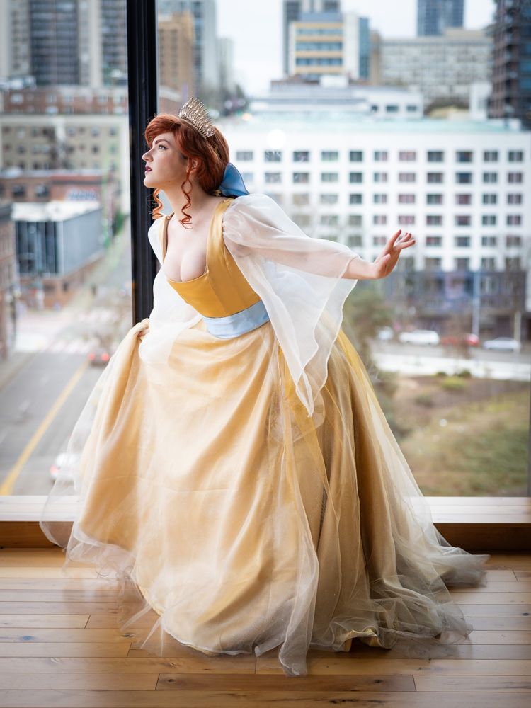 A cosplayer dressed as Anastasia from the 1997 animated movie during the song "Once Upon a December" curtseying. 