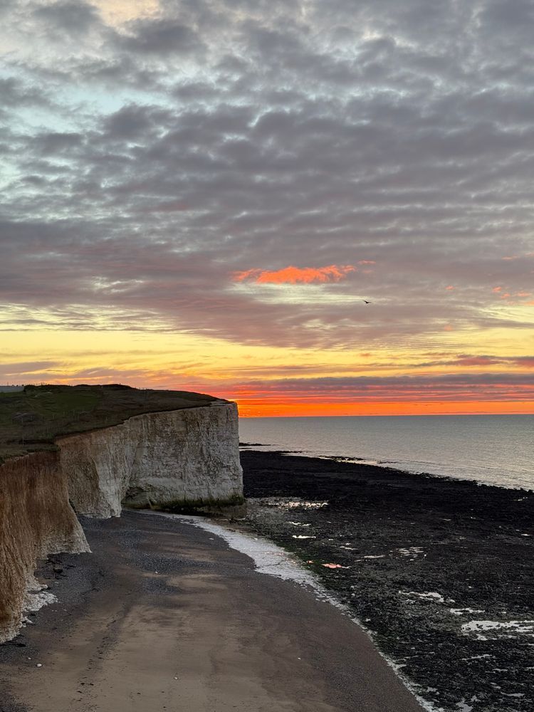 Sunrise over the cliffs and beach on the south coast of England