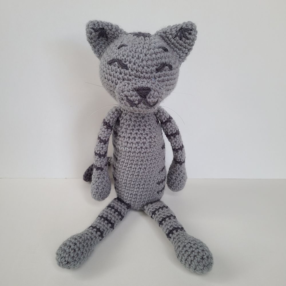 Grey amineko kitty on a white background