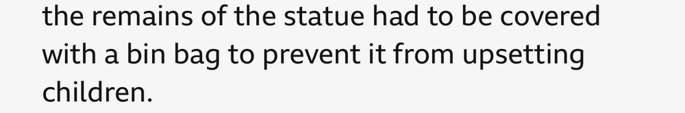 Screen grab of the linked news story reading “the remains of the statue had to be covered with a bin bag to prevent it from upsetting children.”