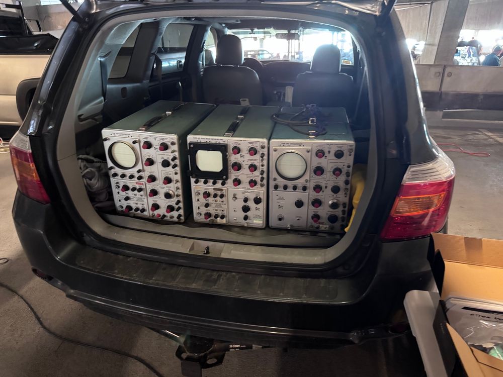 Three old-school oscilloscopes for sale out of the back of a car