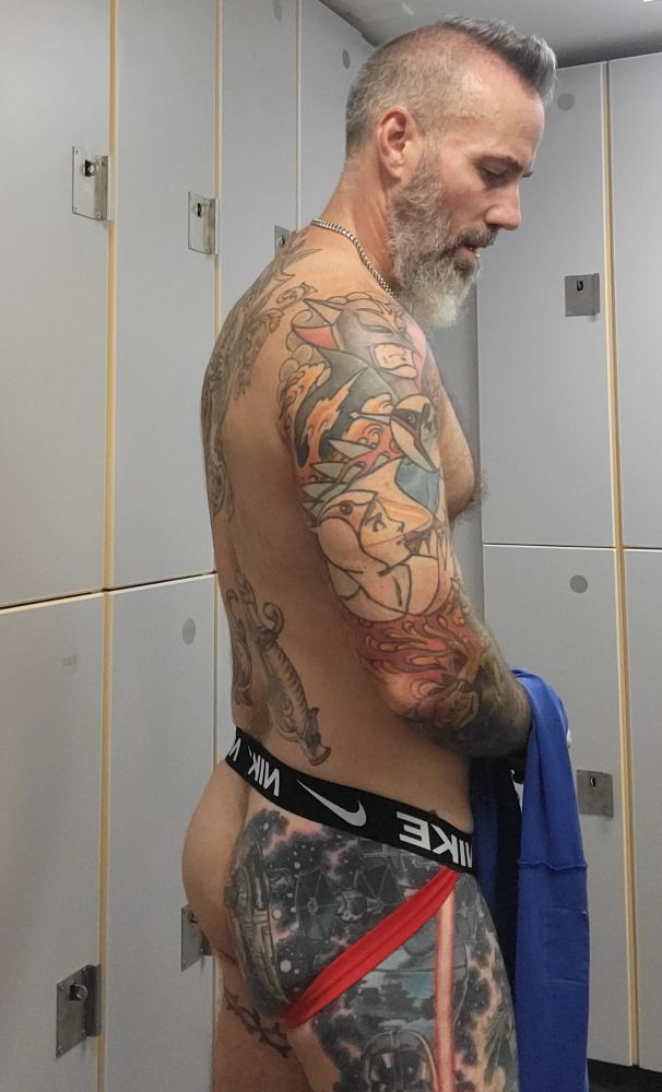 Post workout in the locker room on a red Nike jockstrap. 