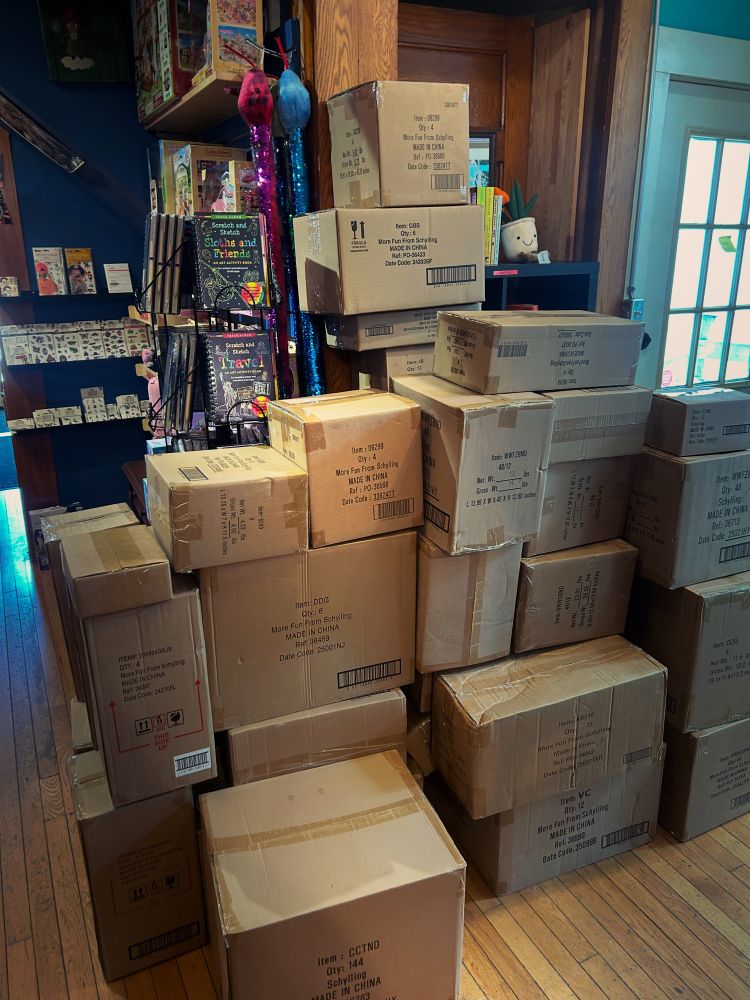 A big stack of boxes full of toys