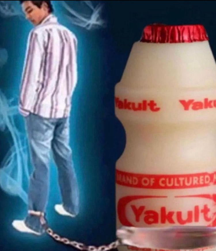 A man chained by the leg to a Yakult bottle, his ultimate vice.