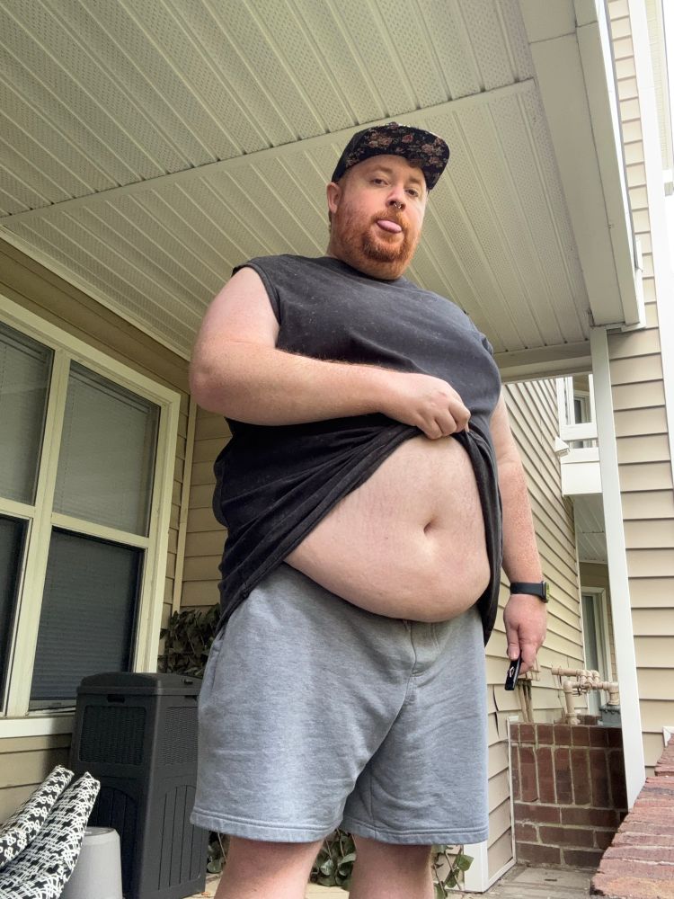 The same as the previous image except Cooper is showing off his belly