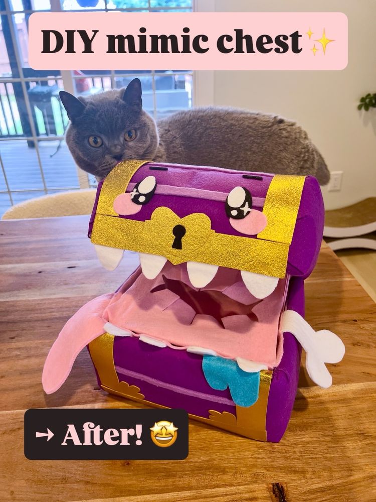 A gray British short hair cat sniffs the finished mimic chest! It’s lined with shiny gold trim and has a bone in its mouth. It turned out super cute.