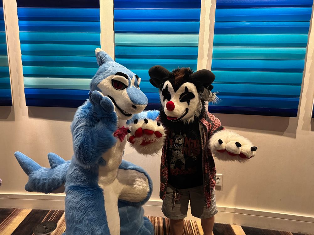 Shark fursuiter and hybrid clown fursuiter