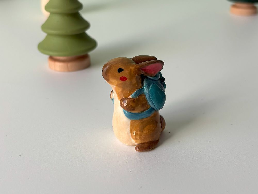 hiking bunny figurine 