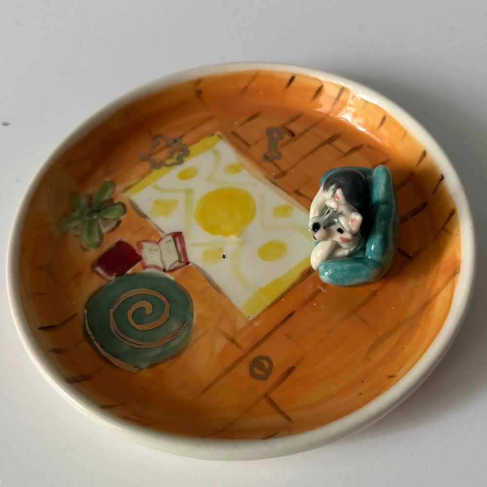 Jewelry dish with a dog on a sofa 