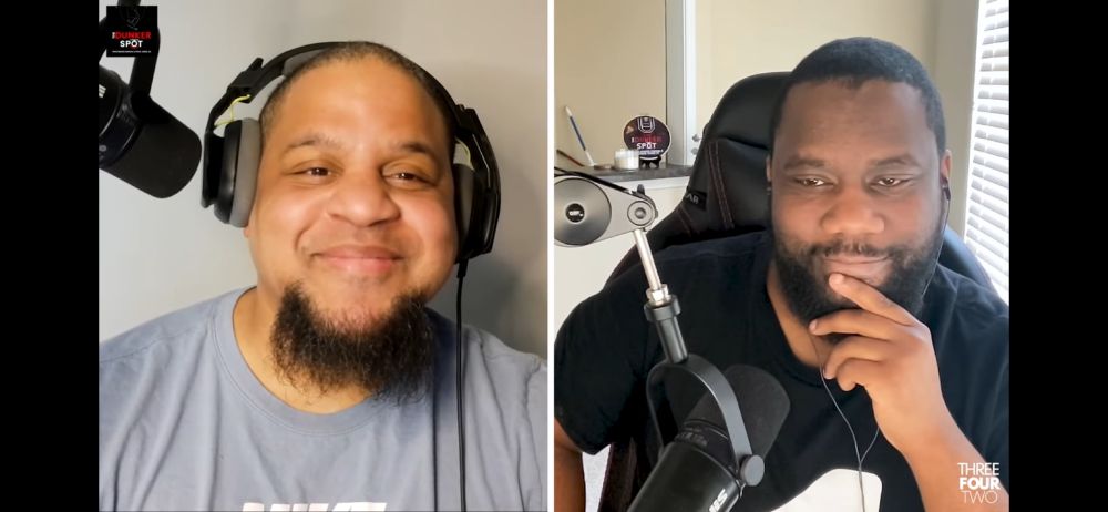 A screenshot of Steve Jones Jr. and Nekias while recording their Dunker Spot podcast. Steve is wearing headphones and a gray shirt. Nekias is wearing his earbuds a black shirt, as per usual. They are both grinning at each other. At the actual time of the screenshot, Steve was asking Nekias who he thinks has a better NBA MVP case this season: James Harden or Ja Morant. But it LOOKS like Steve just asked Nekias, “Hey, you want to get some of those Roadhouse rolls, big dog?”