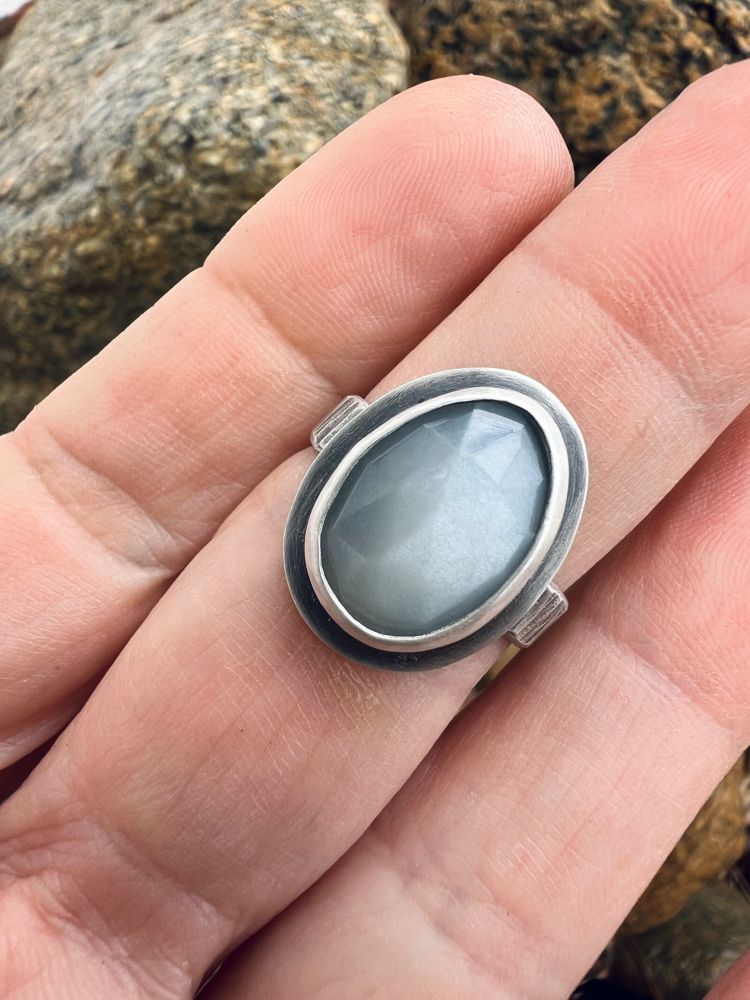 Faceted moonstone ring bezel set in sterling silver, shown with the hand that made it. #metalsmith #silversmith #handforged #handmadejewelry