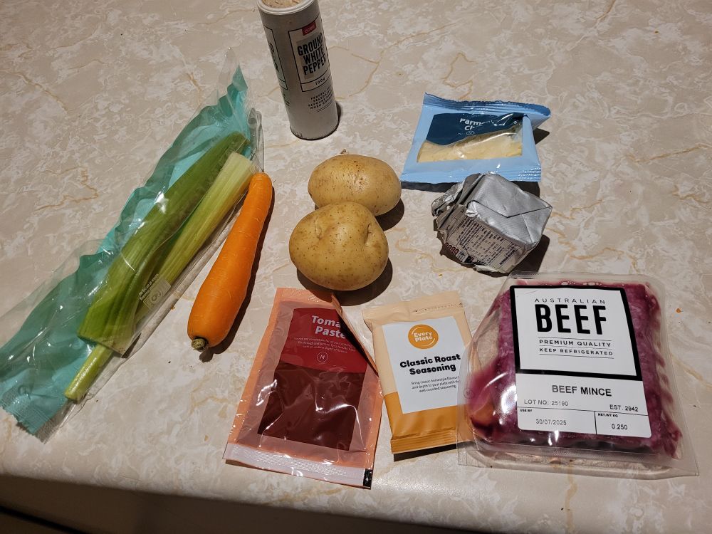 Mince, potatoes,  carrot, celery, tomato.paste, spices, butter, cheese