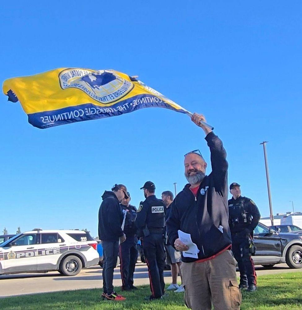 a show of defiance moments after police told the postal workers their picket action was violent and illegal, and demanded they stop disrupting traffic (which everybody on the line rightfully called bullshit on)