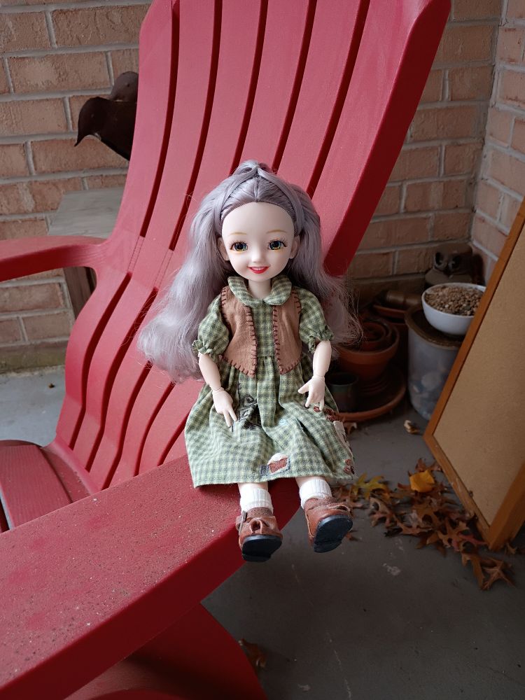 Doll enjoying the balcony on a Beautiful Fall Day.