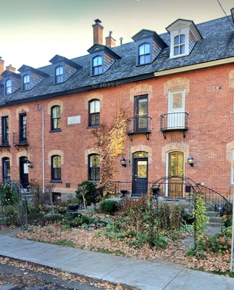 Red brick townhouses in Ottawa ON with very cute gable windows