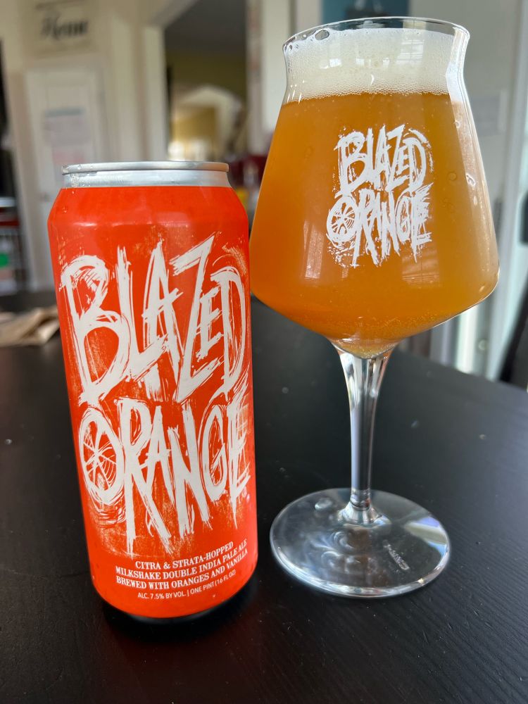 Hop Butcher’s exquisite Blazed Orange Milkshake DIPA, lovingly poured into a teku glass with the same logo
